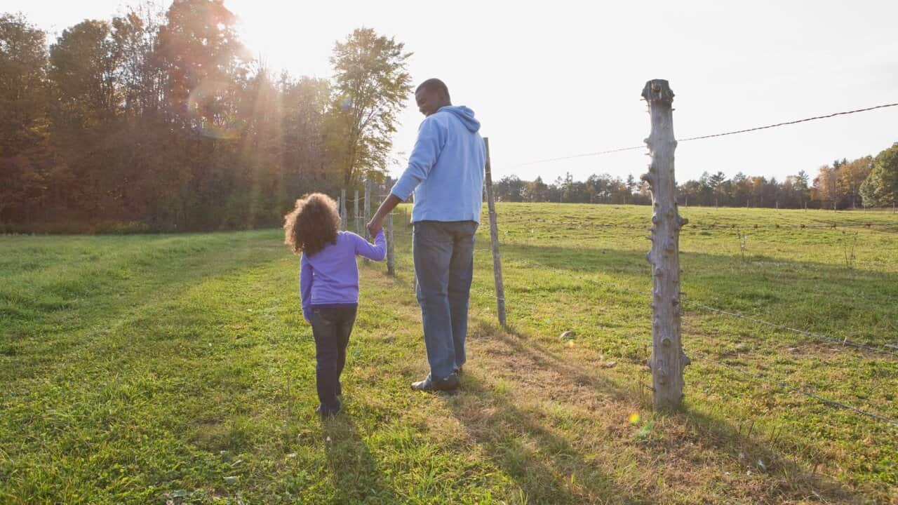 Father and daughter walking