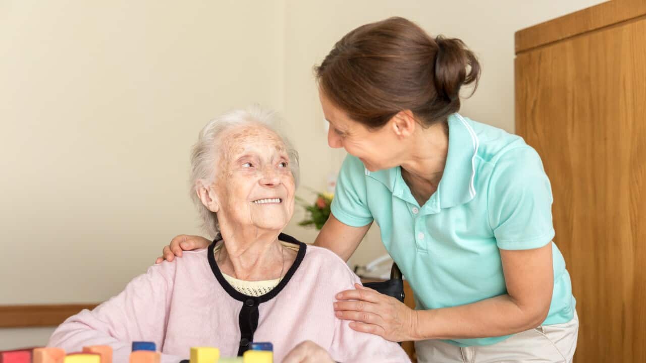 Dementia Home Caregiver and Senior Adult Woman