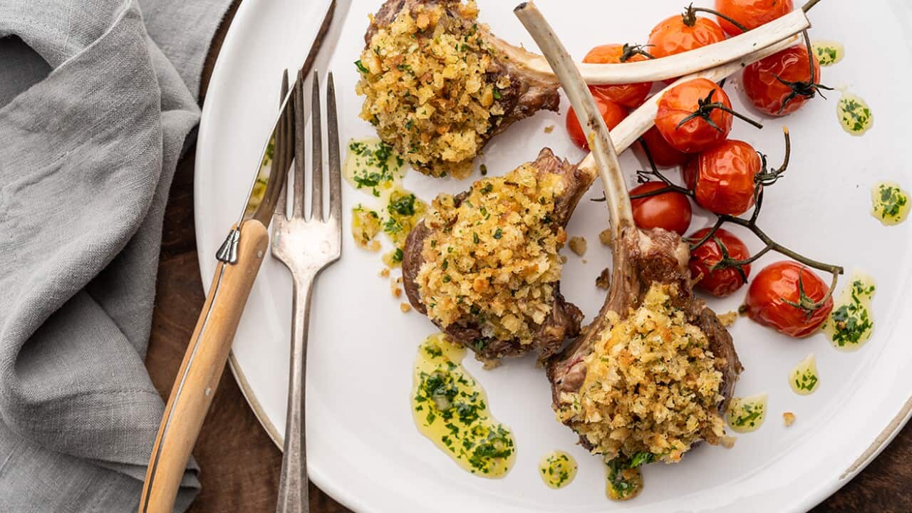 Herb-crusted lamb with roasted cherry tomatoes