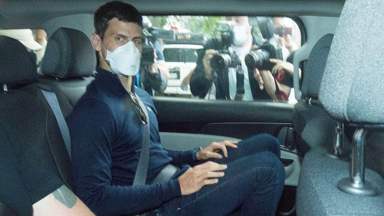 Serbian tennis player Novak Djokovic (centre) departs from the Park Hotel government detention facility before attending a court hearing