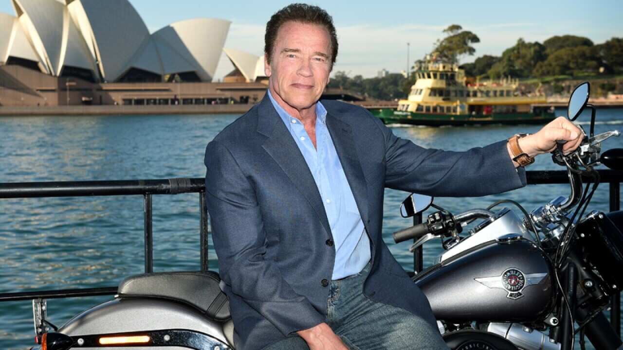 Arnold Schwarzenegger poses for a photograph in Sydney
