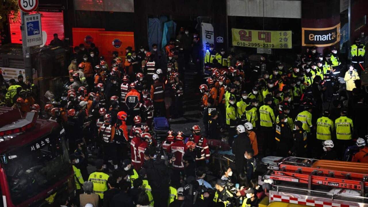 Rescue officials and police gather in the district of Itaewon in Seoul after a Halloween crush that left at least 140 people dead.
