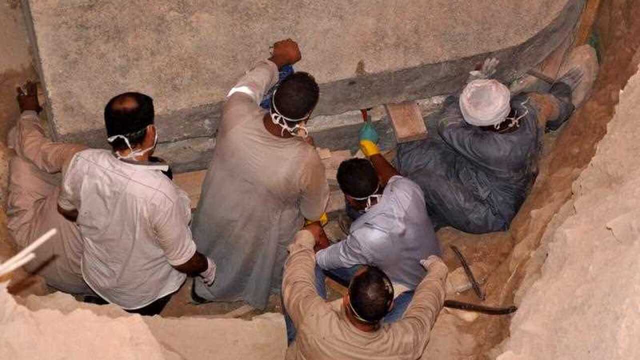 Workers preparing to open the black granite sarcophagus that was discovered in Sidi Gaber district, Alexandria, Egypt, 19 July 2018.