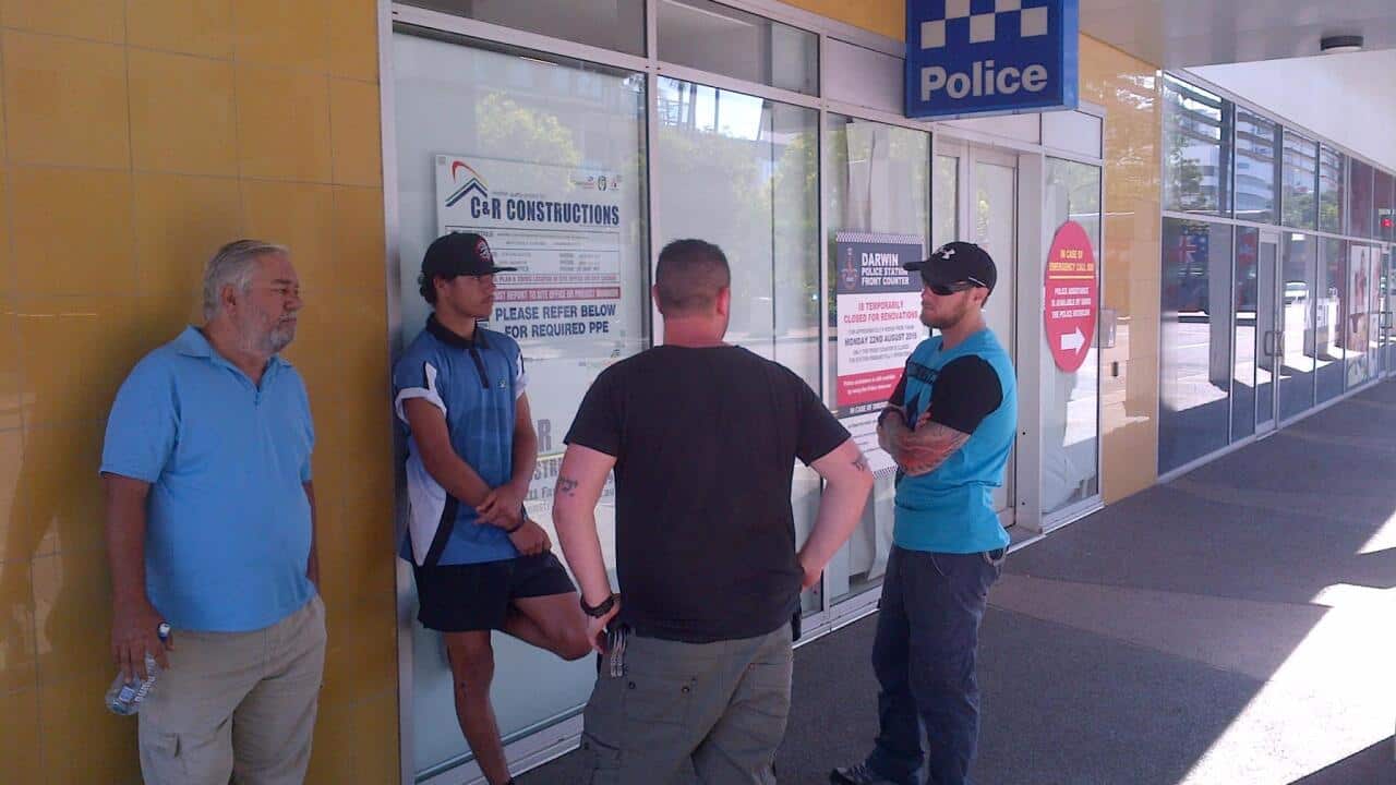 The Rogan family outside the police station in Darwin.