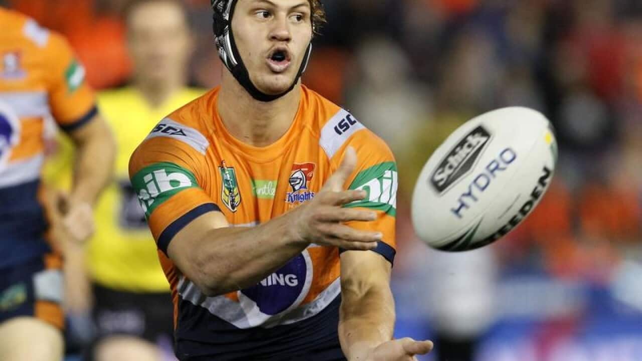 Kalyn Ponga of the Knights passes the ball