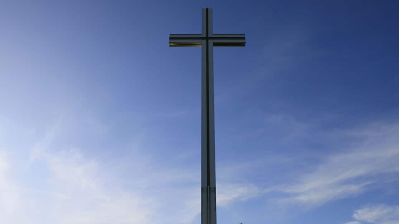 A man walks past the Papal Cross,Ireland