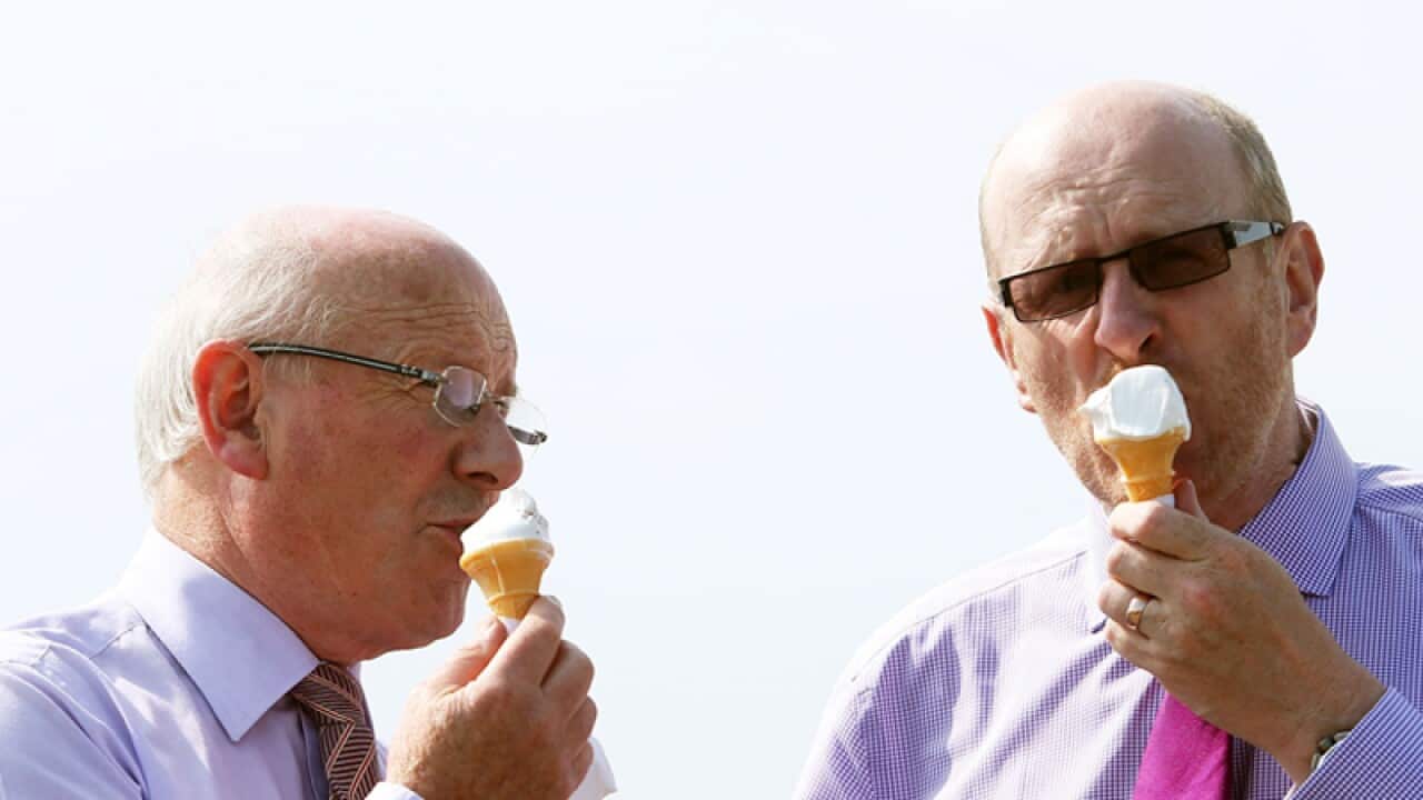 Racegoers enjoy an ice cream