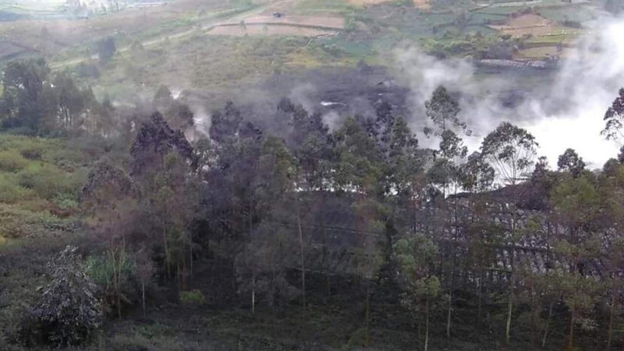 Smoke billows from Sileri Crater