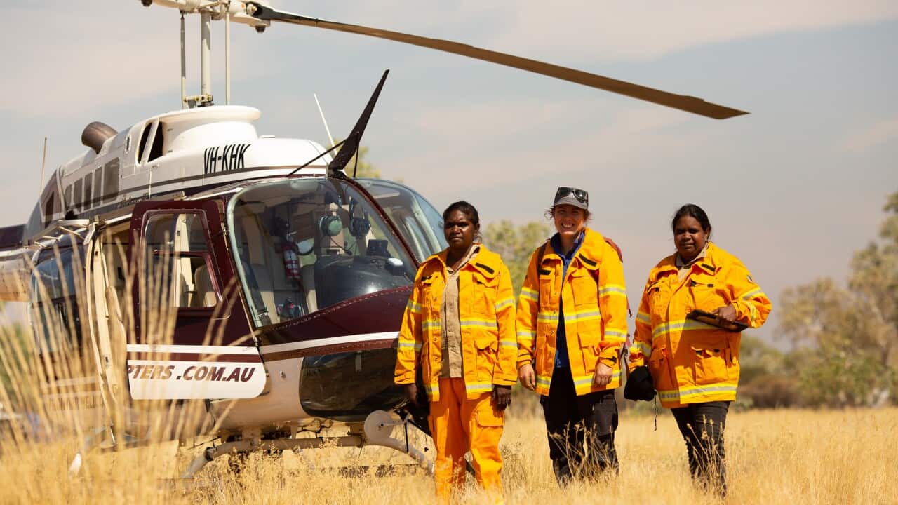 Ngurrara Ranger Regina Thirkall, Hannah Cliff from Indigenous Desert Alliance and Ngurrara Ranger Sumayah Surprise on Ngurrara Country in the Great Sandy Desert preparing for aerial incendiary burning.jpg