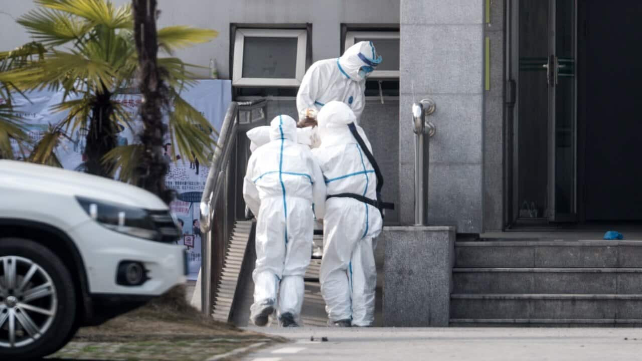 Medical staff in Wuhan, China take a patient suspected of carrying a new coronavirus into hospital