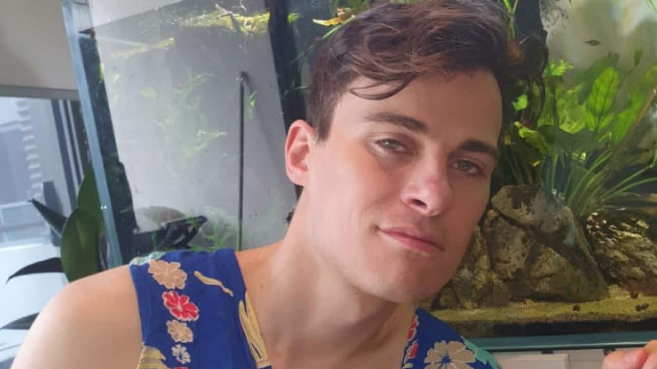 A man wearing a patterned shirt