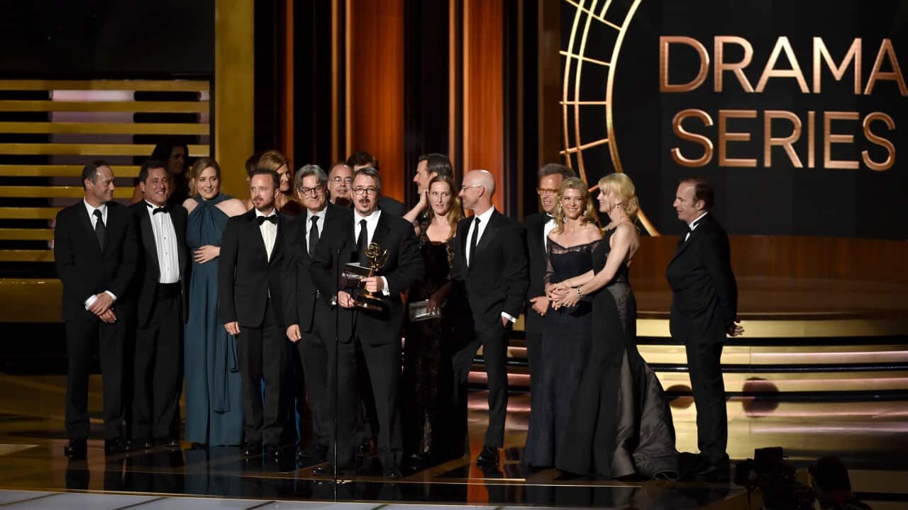 Show creator Vince Gilligan (C) with cast and crew accept Outstanding Drama Series for 'Breaking Bad' onstage at the 66th Annual Primetime Emmy Awards (AAP)