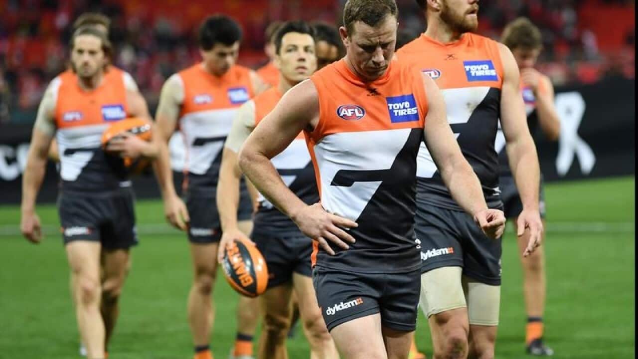 Steve Johnson of the Giants walks off the pitch
