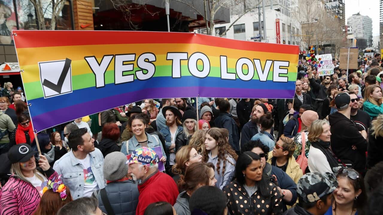 Supporters join in the marriage equality rally in Melbourne. Saturday, August 26, 2017. The crowd rallied in support of a 'yes' vote in the upcoming marriage equality postal survey. (AAP Image/David Crosling) NO ARCHIVING