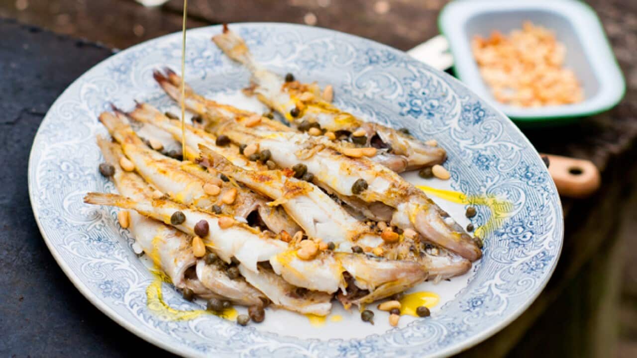 Barbecued whole whiting with capers and pine nuts