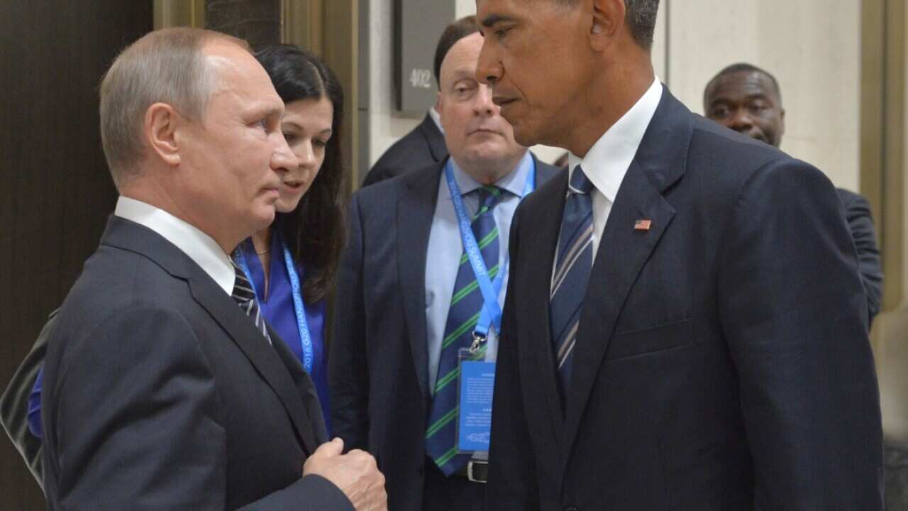 Russian President Vladimir Putin, left, speaks with U.S. President Barack Obama in Hangzhou in eastern China's Zhejiang province, Monday, Sept. 5, 2016.