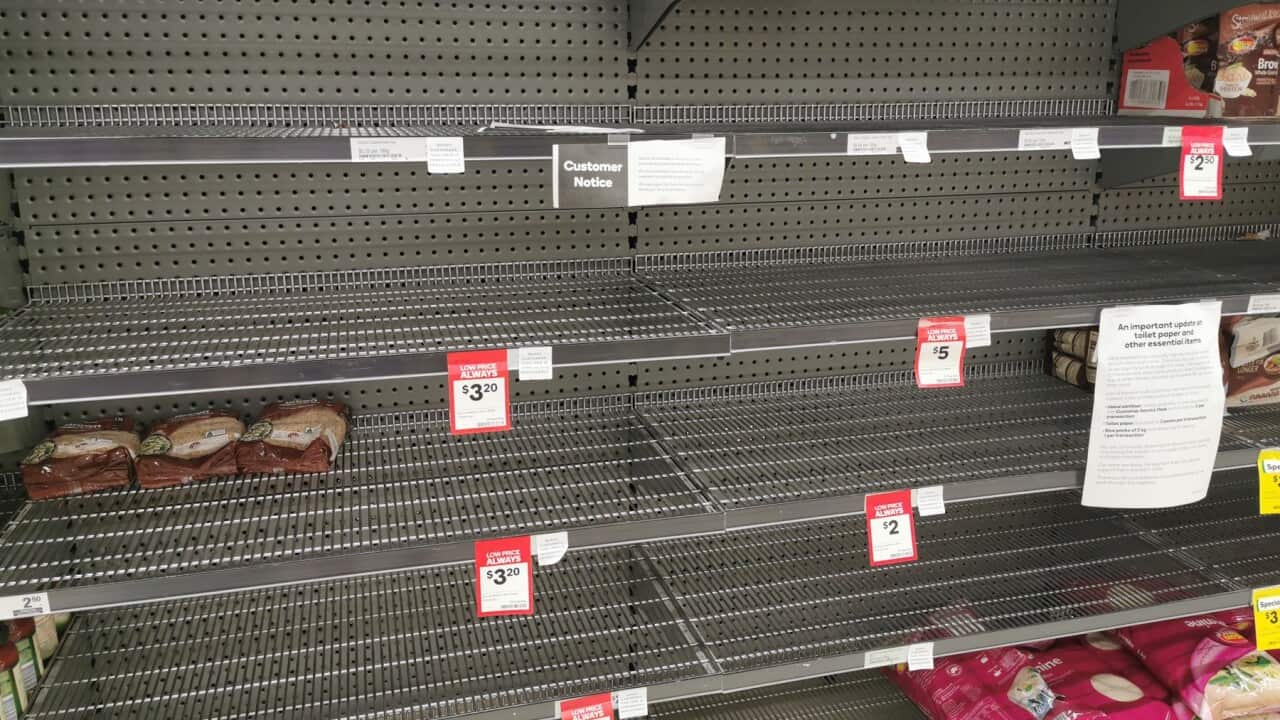 Empty rice and food aisles shelves at a supermarket in Brisbane