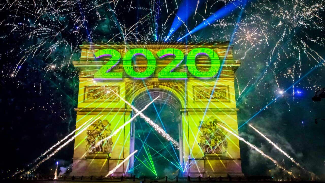 epa08096984 The New Year video is projected onto the Arc de Triomphe on the Champs Elysees in Paris, France, 01 January 2020. EPA/CHRISTOPHE PETIT TESSON