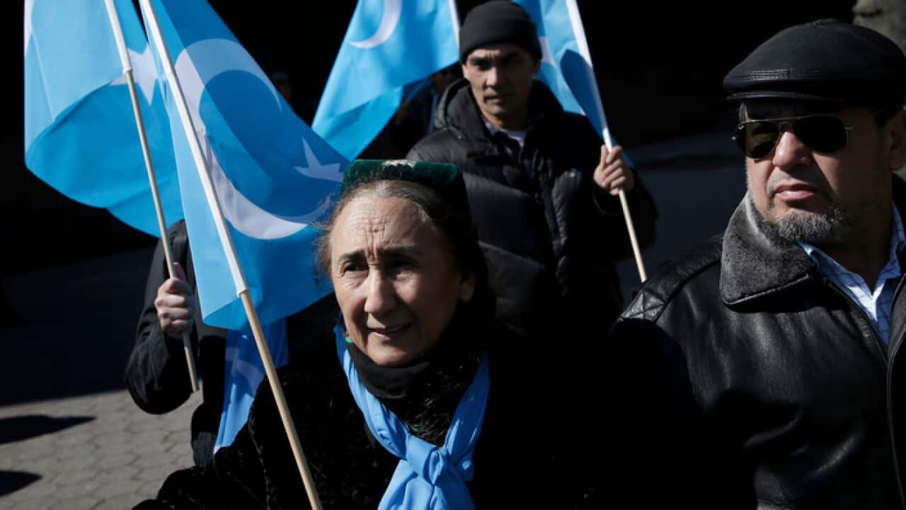Uighurs and their supporters rally outside the United Nations headquarters in New York