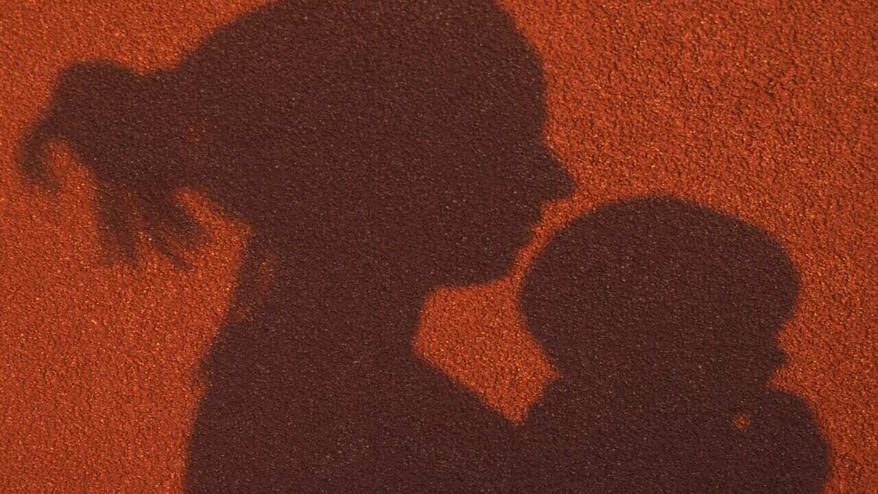 Shadow of woman and a baby