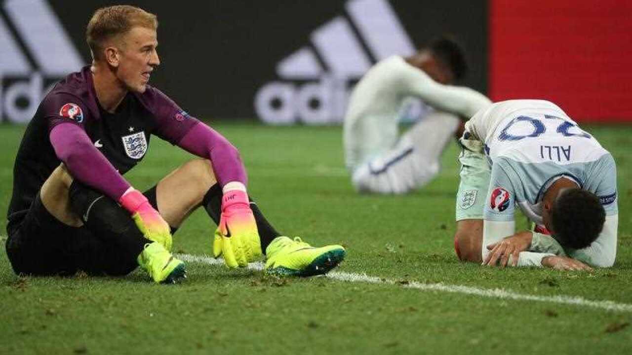 Goalkeeper Joe Hart (L) of England reacts at the end of the UEFA EURO 2016 round of 16 match between England and Iceland