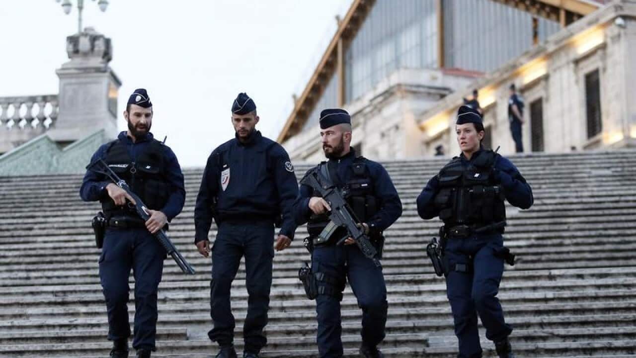 Police officers guard the Saint Charles train station in Marseilles