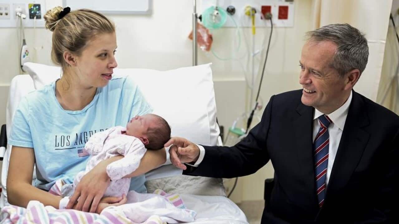 Opposition Leader Bill Shorten with new mother Cassandra and her baby.