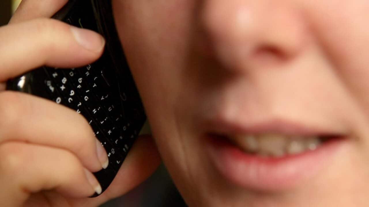 A woman talking on a phone