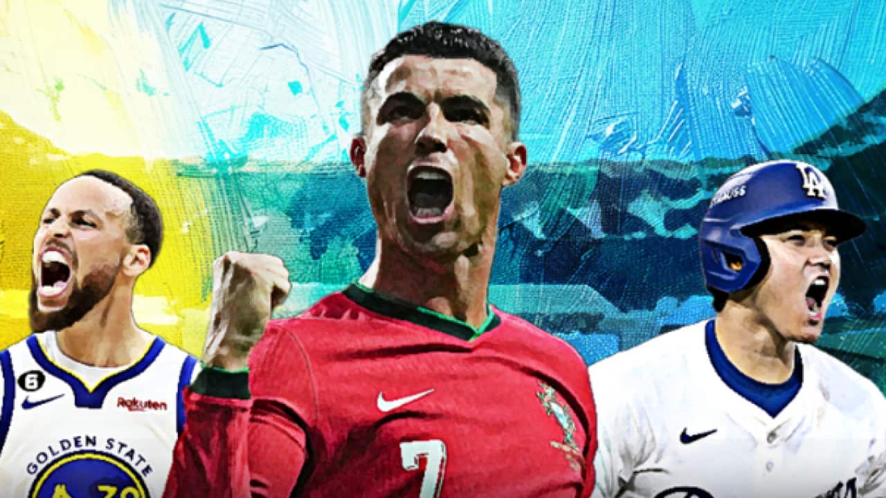 Cristiano Ronaldo, wearing a red long-sleeved shirt, smiles as he looks sideways.
