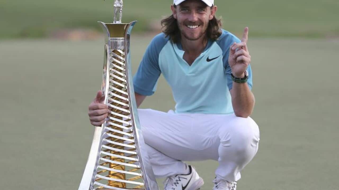 Brit Tommy Fleetwood poses with the Race to Dubai trophy.
