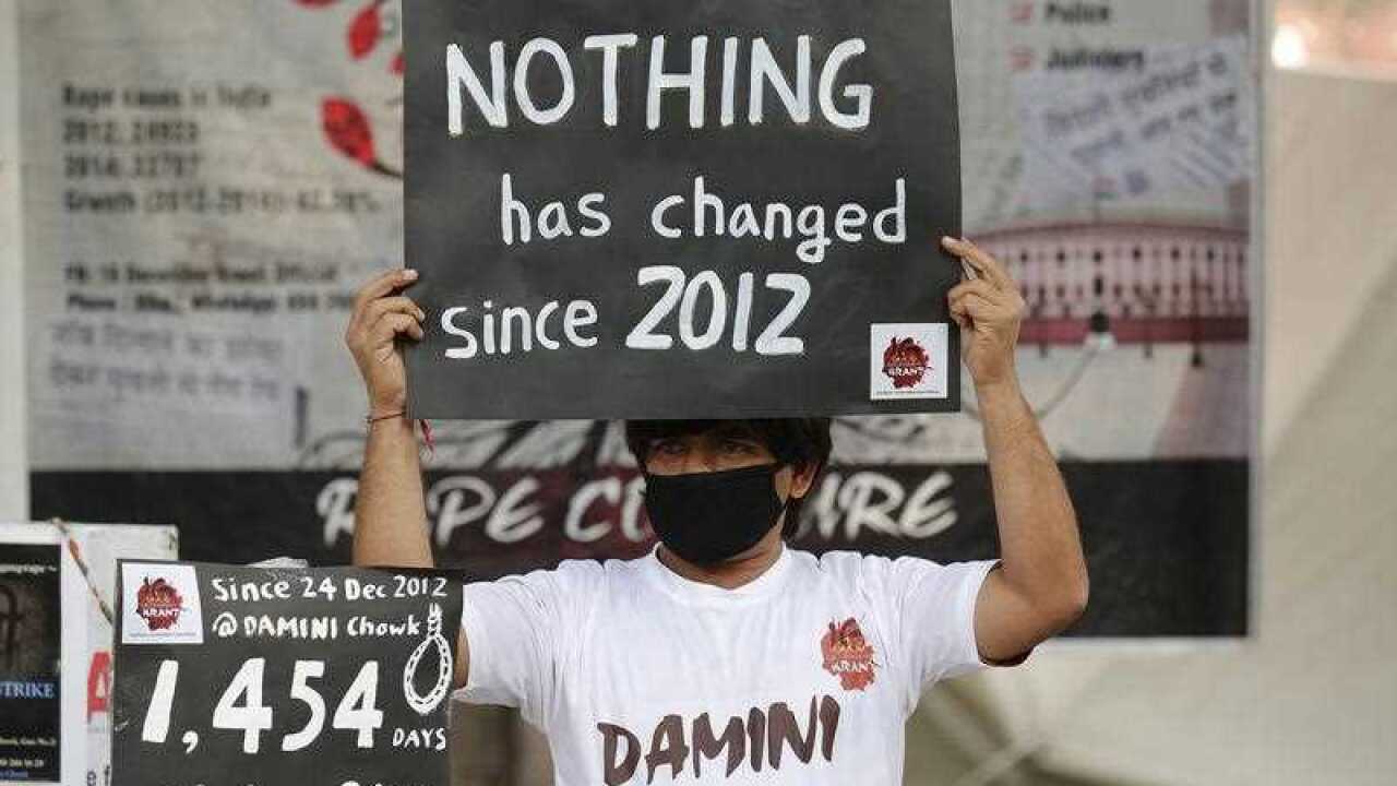 An Indian activist holds placards as he takes part in a protest to mark fourth anniversary of the Delhi gang rape crime, at Jantar Mantar in New Delhi, India, 16 December 2016.