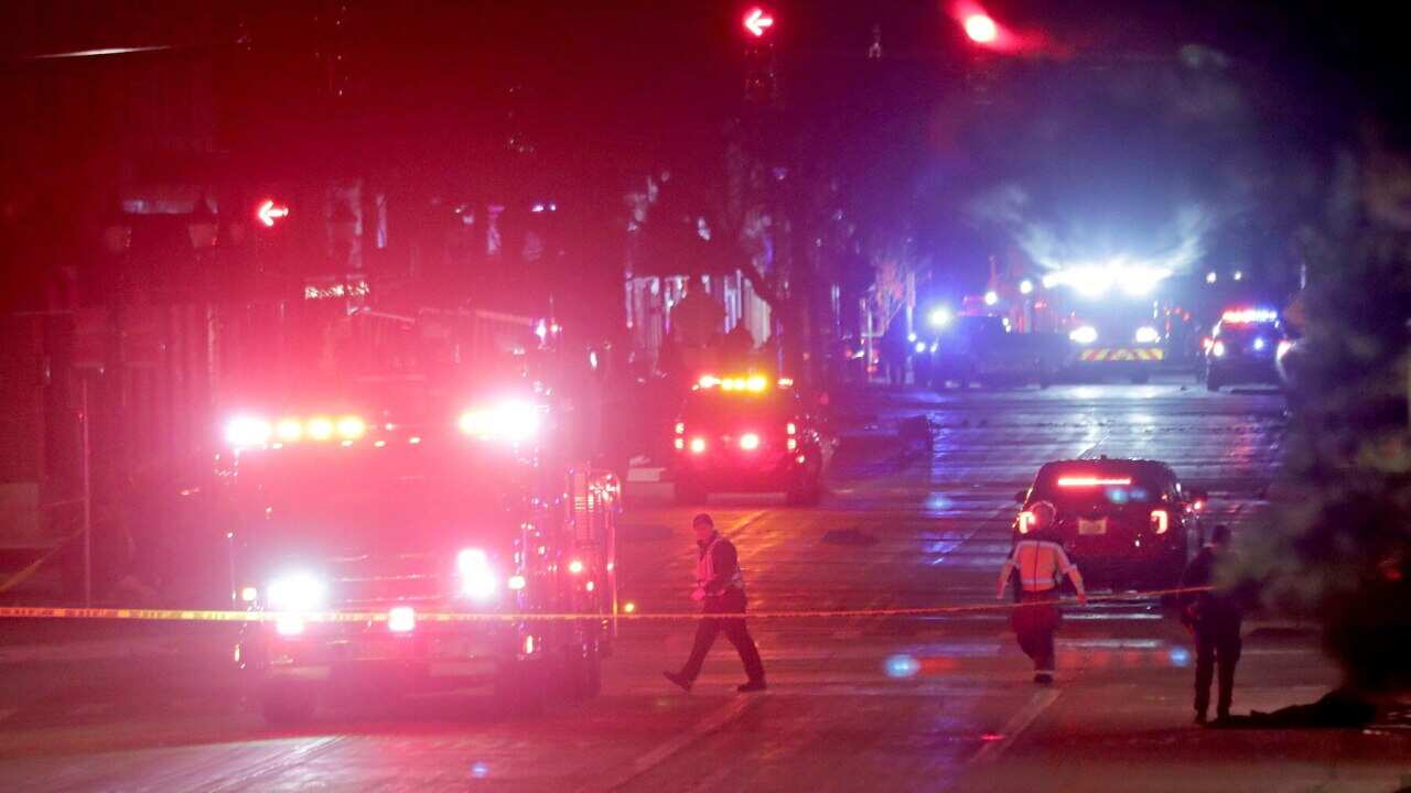 Police investigate at the scene of the Waukesha incident