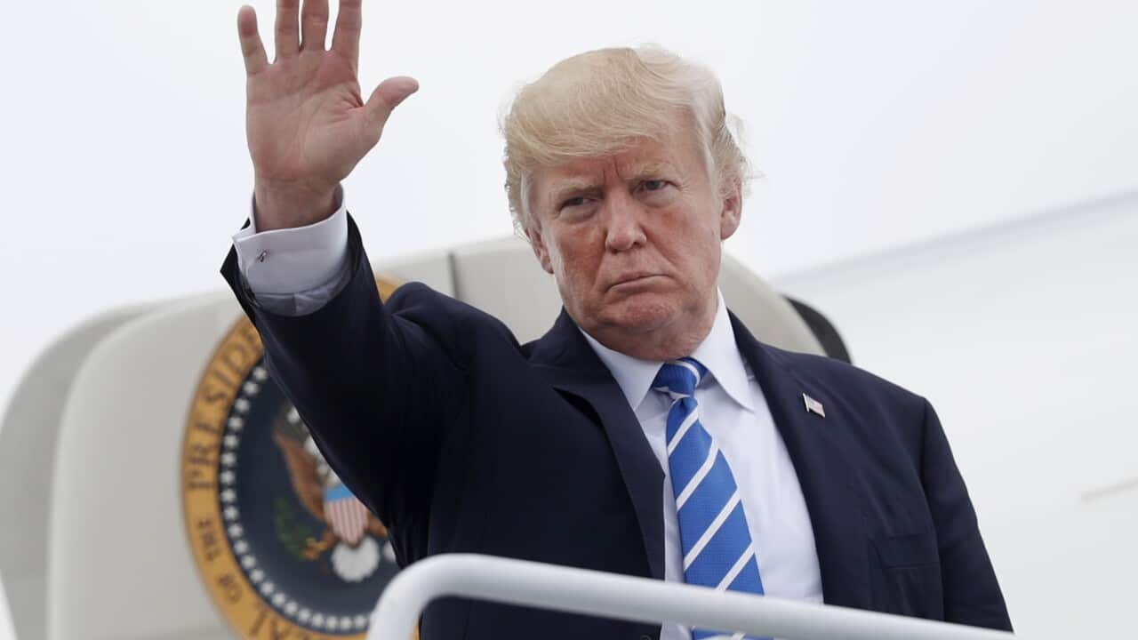 President Donald Trump waves as he boards Air Force One at Hagerstown Regional Airport in Hagerstown.