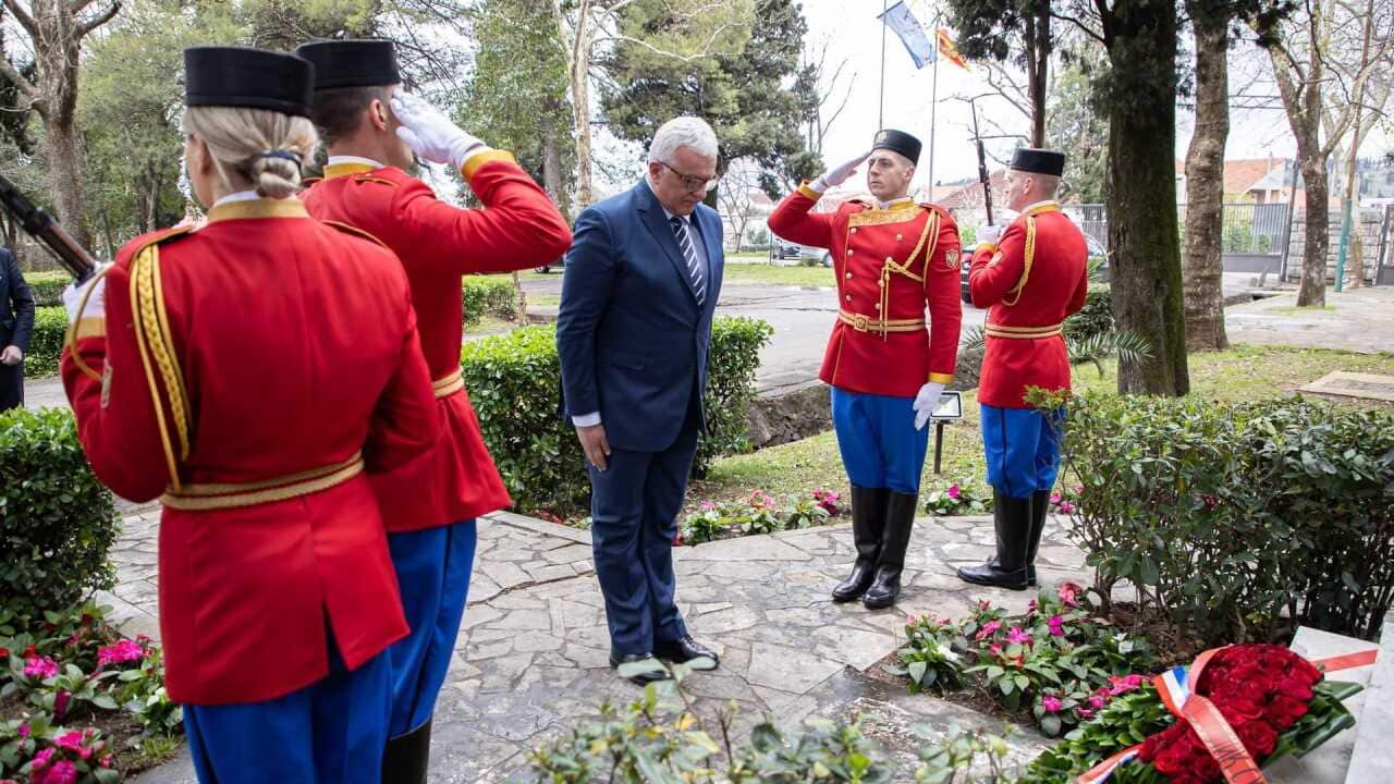 Montenegro's Parliament Speaker Andrija Mandic lays a wreath on the memorial of NATO bombing victims in Danilovgrad