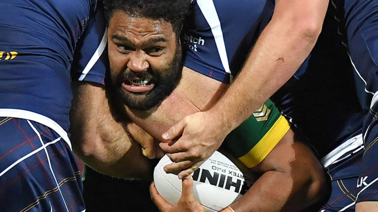Australia's Sam Thaiday is tackled