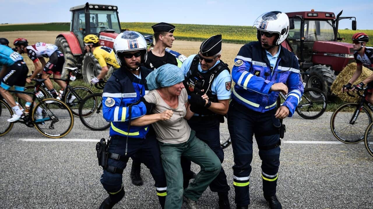 Protesters interrupted the Tour de France on Tuesday.