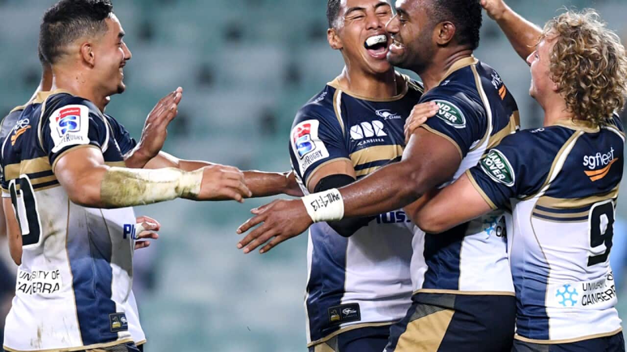 Tevita Kuridrani of the Brumbies is congratulated after scoring