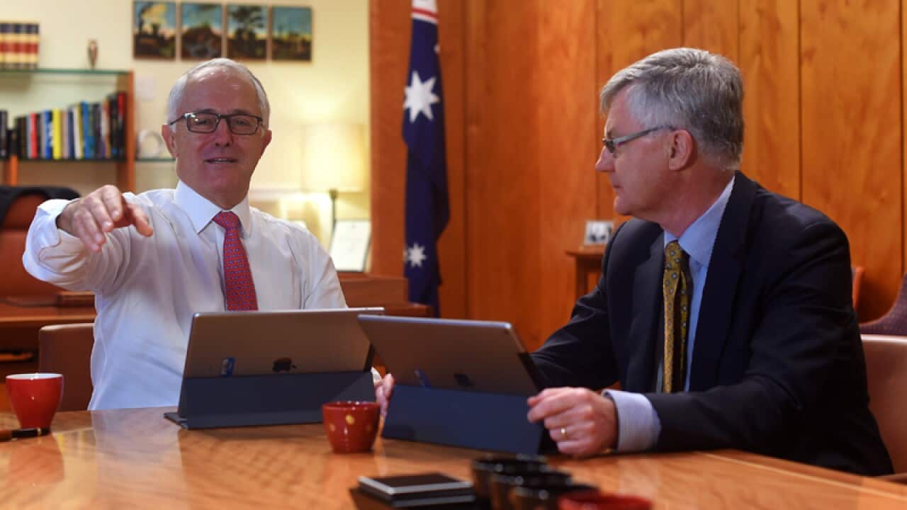 Malcolm Turnbull speaks to Martin Parkinson