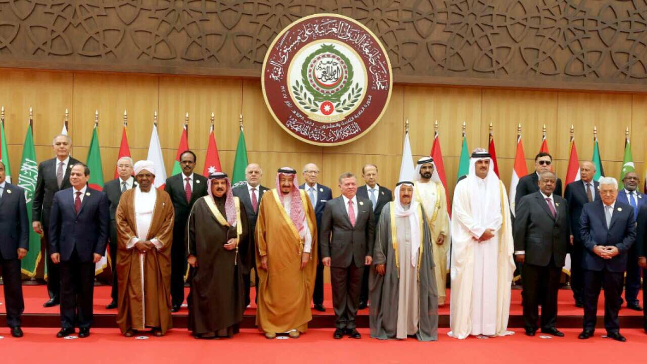 Leaders and heads of delegations pose for a group picture before the opening ceremony of the 28th Arab League Summit meeting at Dead Sea,