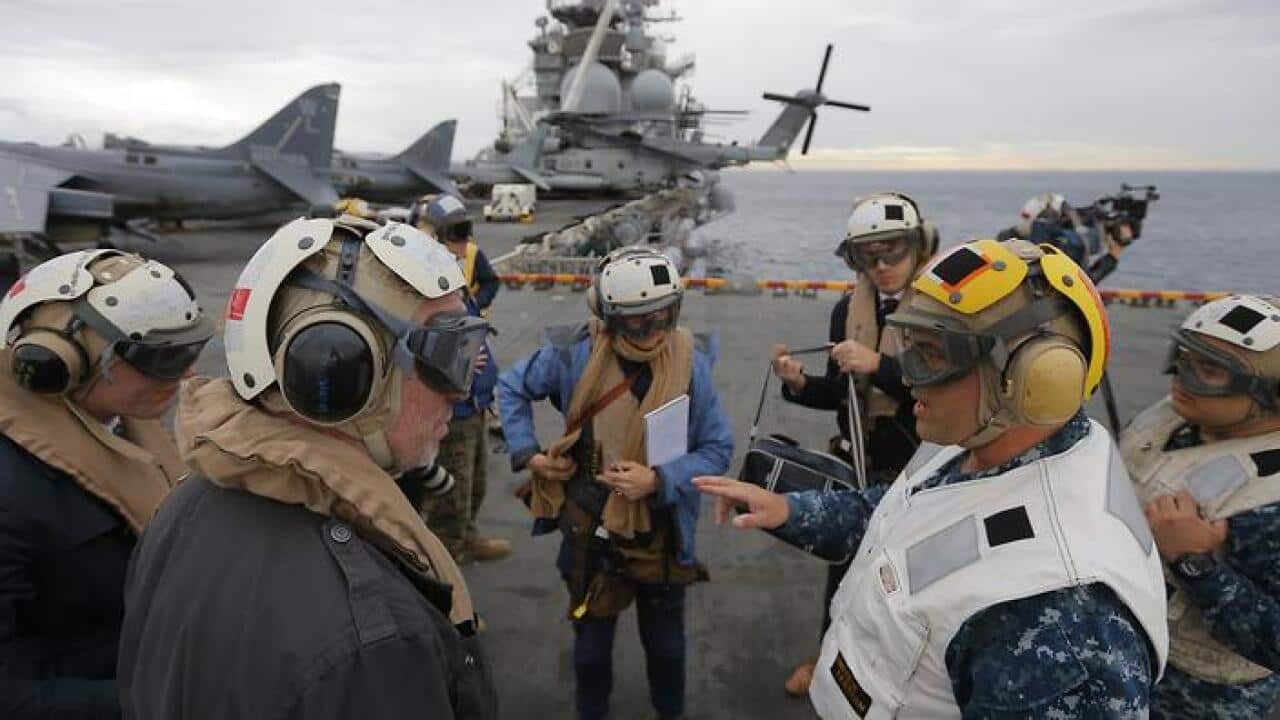USS Bonhomme Richard amphibious assault ship Executive Officer Rich Lebron (2nd R) speaks to Australian journalists In the Pacific Ocean off the coast of Sydney, Australia, June 29, 2017 before a ceremony marking the start of Talisman Saber 2017, a bienni