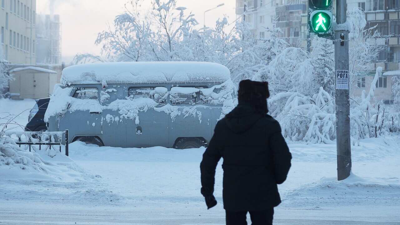 A van blanketed in snow in Yakutsk, Siberia, 15 January 2020.