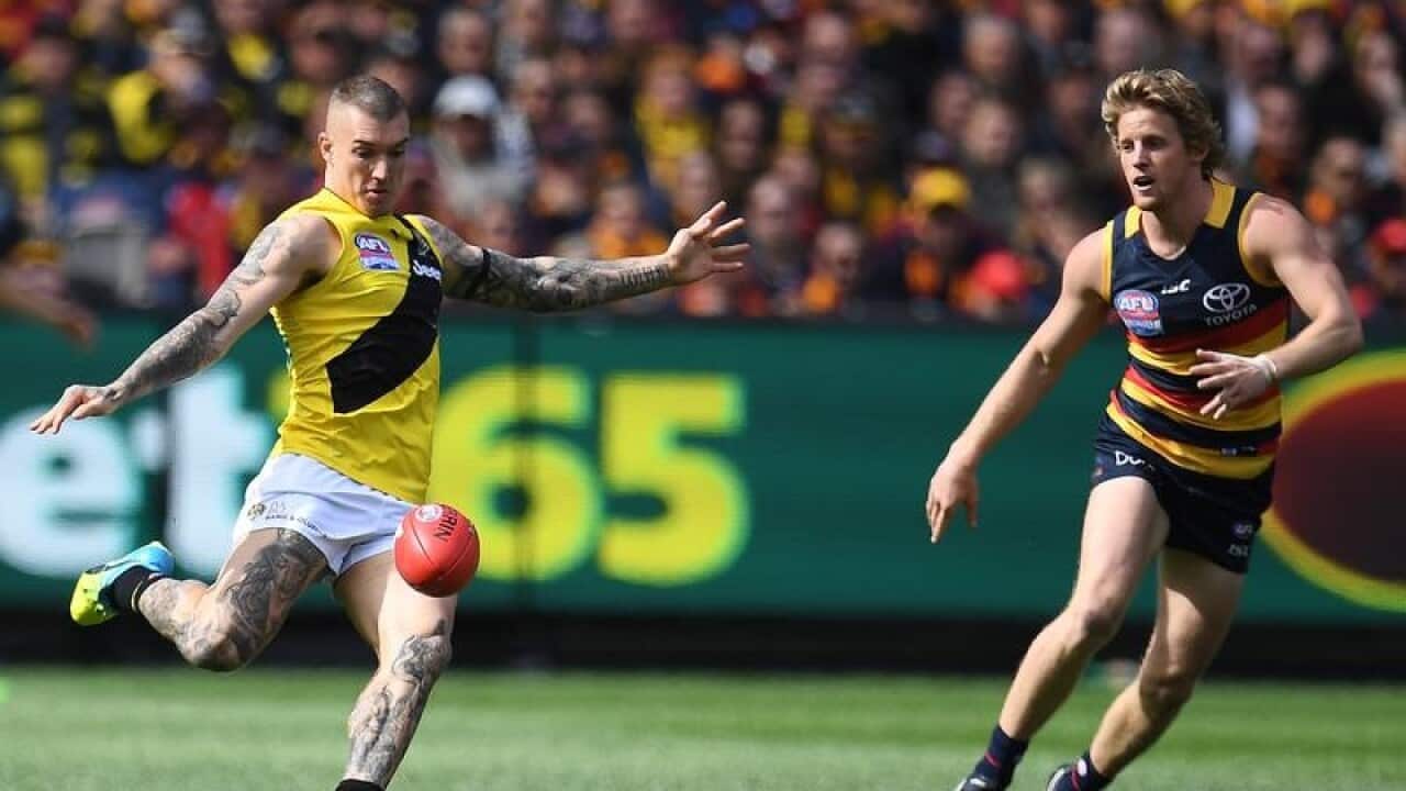 Dustin Martin of the Tigers (l) and Rory Sloane of the Crows