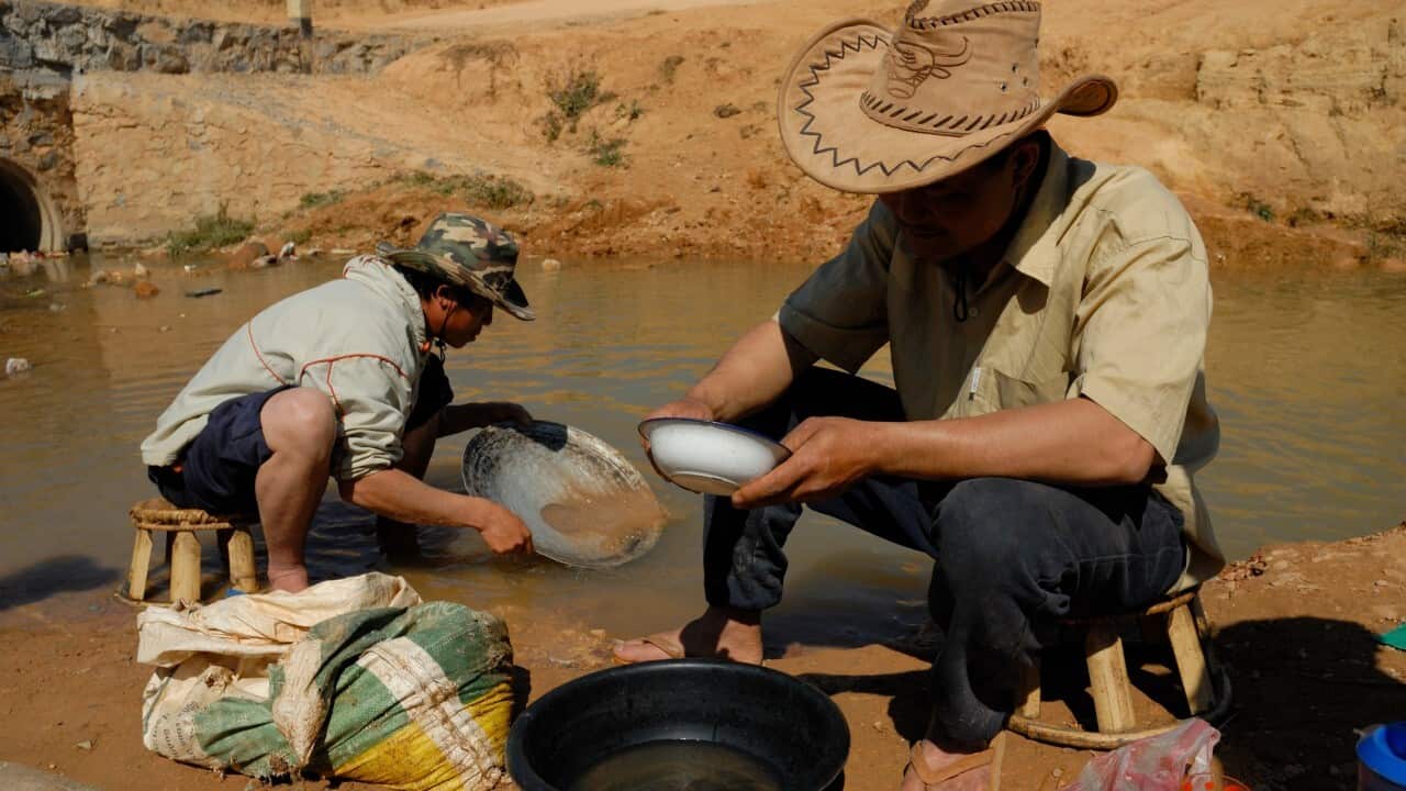 Two gold prospectors in a creek in Phonsavanh, Xieng Khouang, Laos ( Jerry Redfern - LightRocket via Getty Images)