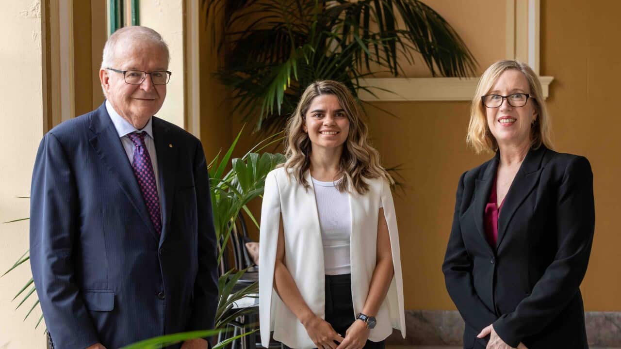 Taylah Gray poses with Chief Justice Tom Bathurst and Professor Tania Sourdin.
