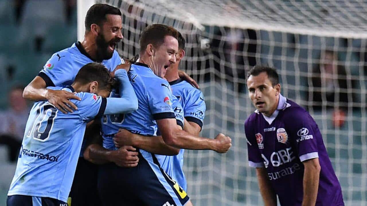 Sydney FC players celebrate their goal