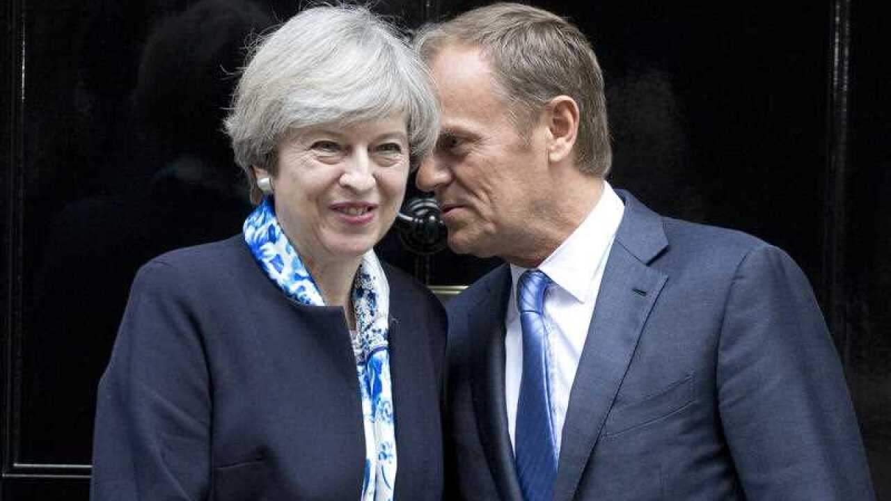 British Prime Minister Theresa May steps out Downing Street, London, to greet European Council President Donald Tusk.