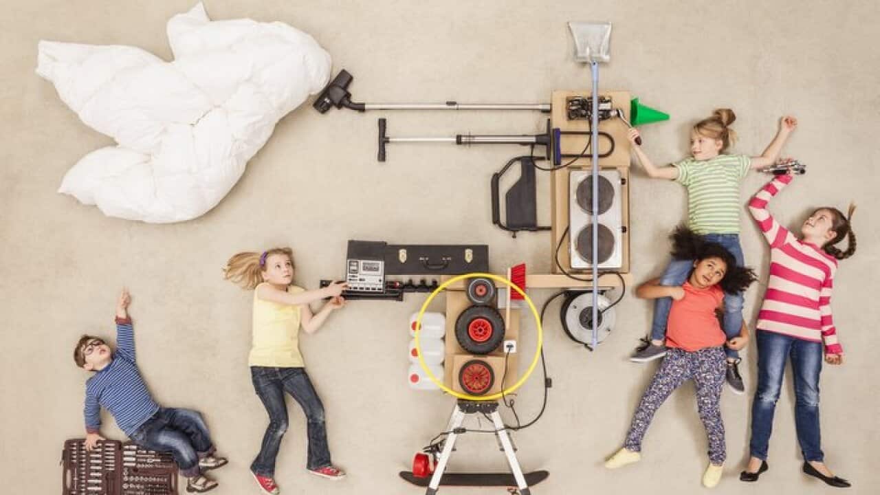 Children experimenting with new weather machine