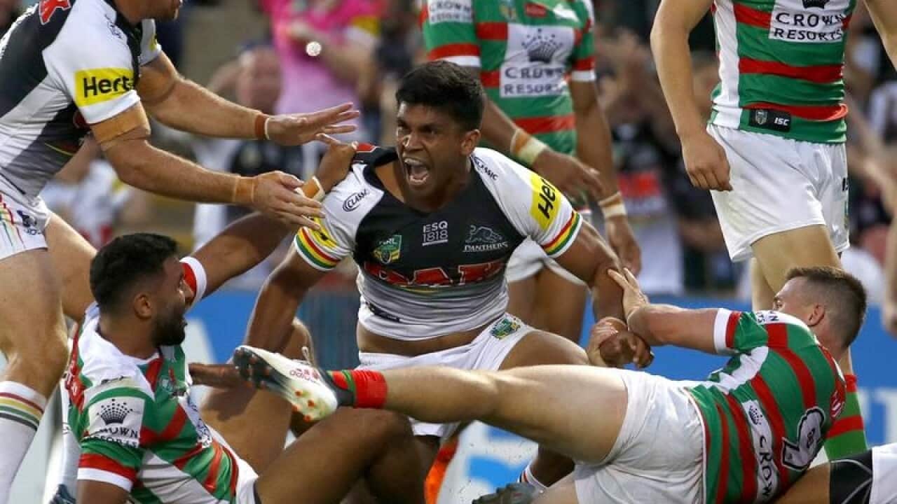 Tyrone Peachey of the Panthers react after scoring a try.