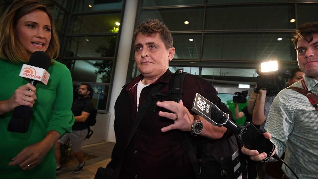 Bali Nine drug smuggler Renae Lawrence was pursued by reporters at Brisbane airport.