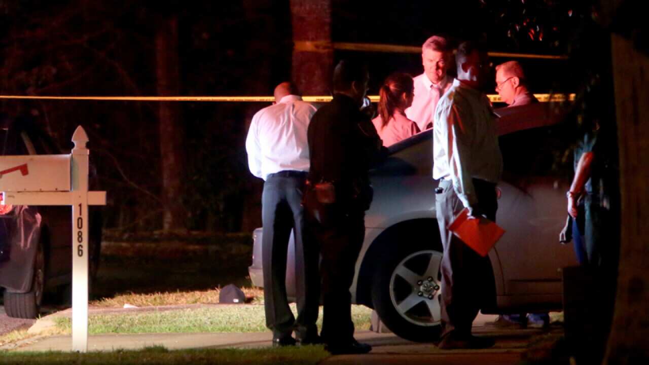 Investigators outside a Florida home